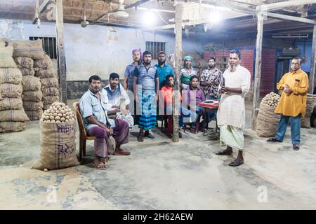 KHULNA, BANGLADESH - NOVEMBER 12, 2016: Local potato dealers at a market in Khulna, Bangladesh Stock Photo