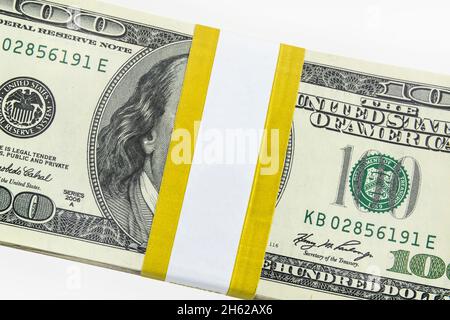 US hundred dollar money bundle with blank currency strap. Stock Photo