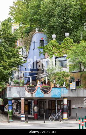 the hundertwasserhaus,residential complex and terrace cafe,löwengasse at the corner of kegelgasse,3rd district,landstrasse,vienna,austria Stock Photo