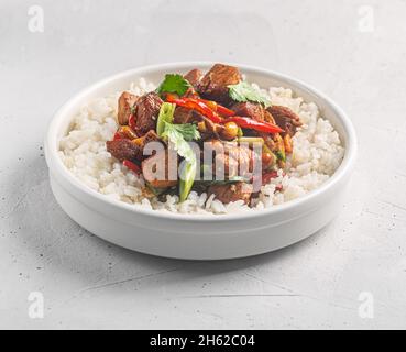 Kung pao or kung po, traditional chinese food prepared with chicken, beef or pork meat, sometimes sea food, with rice as a sidedish Stock Photo