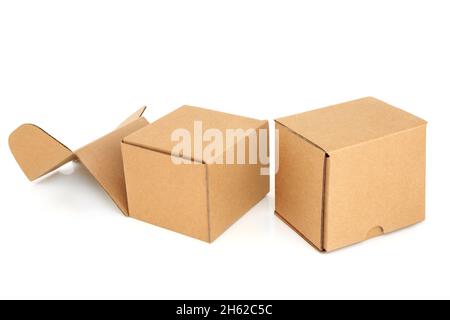 Two cube shaped cardboard box containers one with lid open, one shut  on white background. Design element. Copy space. Stock Photo