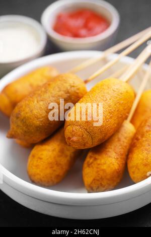 Corn dog cooked with sausage and wheat dough with the addition of corn flour, selective focus Stock Photo