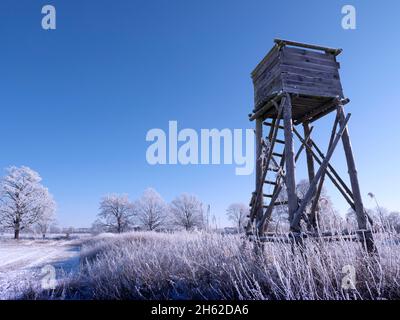 high seat in winter,fields and trees covered with hoarfrost Stock Photo