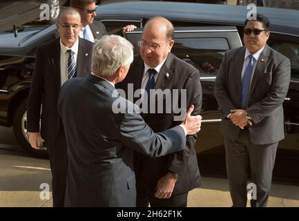 U.S. Secretary of Defense Chuck Hagel, foreground left, greets Israeli Minister of Defense Moshe Ya'alon, center, at the Pentagon in Arlington, Va., Oct. 21, 2014 Stock Photo