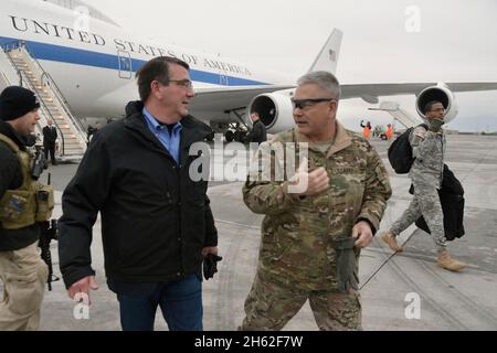 Secretary of Defense Ash Carter is greeted by Gen. John Campbell as he arrives in Kabul, Afghanistan, while making his first international trip as Secretary of Defense Feb. 21, 2015 Stock Photo