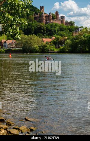 view from kreuzwertheim in bavaria over the main to wertheim castle in baden-wuerttemberg,kayakers on the main Stock Photo