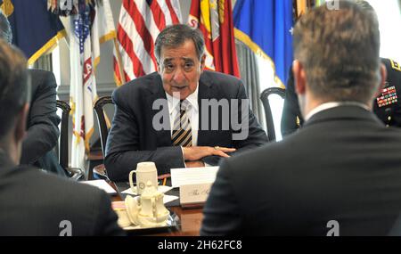 Secretary of Defense Leon Panetta speaks with Finland's Minister of Defense Stefan Wallin, foreground, as they meet in the Pentagon in Arlington, Va., on May 10, 2012. Stock Photo