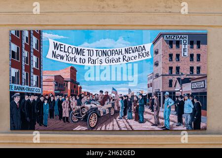 Tonopah, Nevada, US - May 16, 2011: downtown. Large colorfully painted mural remembering 1908 New York to Paris great race featuring antique car and n Stock Photo