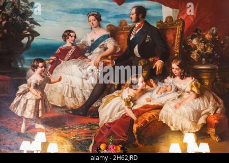 england,isle of wight,east cowes,osborne house,the palatial former home of queen victoria and prince albert,the dining room,painting of the royal family in 1846 (after winterhalter) dated 1862 Stock Photo