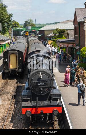england,hampshire,ropley,ropley station,the mid-hants heritage railway aka the watercress line,steam train and passengers in the annual 'war on the line' festival Stock Photo