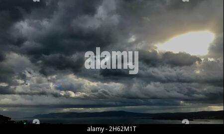 Stormy black clouds in Croatian coastline.Dark sky and black clouds at night, Dark storm and rainy at night. Stock Photo