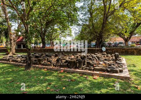 destroyed buddha statues,wat maha that,buddhist temple complex,built in 1374 below king borommaracha i,ayutthaya historical park,ayutthaya,thailand,asia Stock Photo