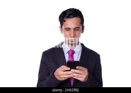 Businessman using a smart phone. Young adult wearing a smart suit checks your cell phone. Isolated on all white background. Stock Photo