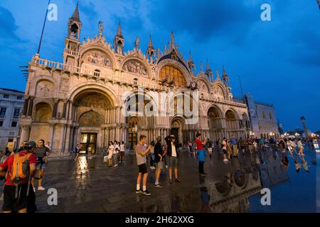 fantastic night on san marco square with campanile and saint mark's basilica. colorful evening cityscape of venice,italy,europe with a lot of reflecting water. Stock Photo