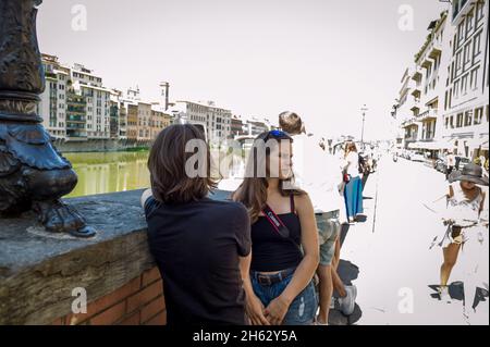 florence,italy,sunset view from ponte veccio on the river arno and ponte santa trinita,a renaissance bridge,the oldest elliptic arch bridge in europe. Stock Photo