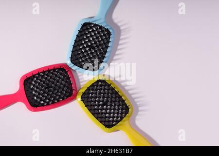 Multi-colored hair combs on an isolated white background.  Stock Photo
