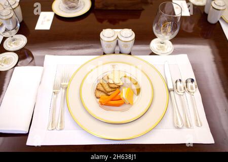 A simple plate of cheese, crackers and carrots is set for for the table setting of the meeting of closed, off-the-record lunch with President Barack Obama and Press Secretary Robert Gibbs in the President's Private Dining Room ca. 2009 Stock Photo