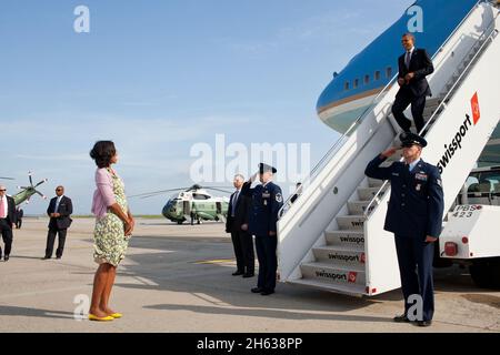 First Lady Michelle Obama waits to greet President Barack Obama upon his arrival at John F. Kennedy International Airport in New York, N.Y., June 14, 2012. Stock Photo