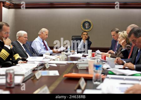 President Barack Obama listens during a meeting about the current situation in Pakistan Oct. 7, 2009 in the Situation Room of the White House. Left to right, Adm. Michael Mullen, chairman of the Joint Chiefs of Staff; Defense Secretary Robert Gates; Vice President Joe Biden; the President; National Security Advisor Gen. James Jones; Secretary of State Hillary Clinton; Director of National Intelligence Adm. Dennis C. Blair (partially obscured); and CIA Director Leon Panetta. Stock Photo