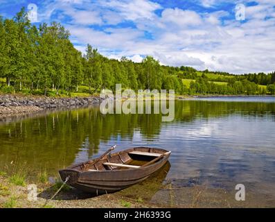 europe,sweden,jämtland province,scenery on the bank of kallsjön,wooden boat,järpen,are, Stock Photo