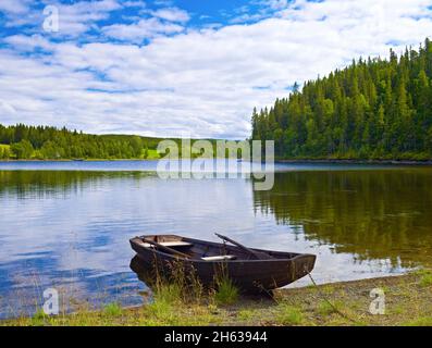 europe,sweden,jämtland province,scenery on the bank of kallsjön,wooden boat,järpen,are, Stock Photo