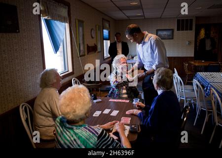 President Barack Obama visits with patrons at Jerry's Family Restaurant in Mount Pleasant, Iowa, April 27, 2010. Stock Photo