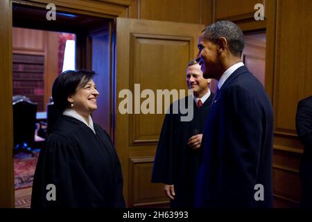 President Barack Obama talks with Justice Elena Kagan and Chief Justice John Roberts after Kagan's  Investiture Ceremony at the Supreme Court, Oct. 1, 2010. Stock Photo