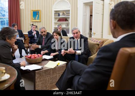 President Barack Obama receives an update on the explosions that occurred in Boston, in the Oval Office, April 16, 2013. Seated, from left, are: Homeland Security Secretary Janet Napolitano; Tony Blinken, Deputy National Security Advisor; Jake Sullivan, National Security Advisor to the Vice President; Attorney General Eric Holder; Lisa Monaco, Assistant to the President for Homeland Security and Counterterrorism; Chief of Staff Denis McDonough; and FBI Director Robert Mueller. Stock Photo