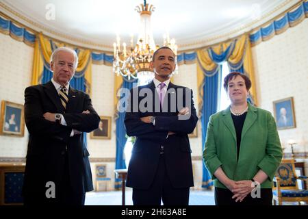 President Barack Obama and Vice President Joe Biden stand with Solicitor General Elena Kagan in the Blue Room of the White House, May 10, 2010, prior to announcing Kagan as his choice to replace retiring Justice John Paul Stevens in the Supreme Court. Stock Photo