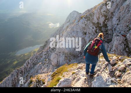 young woman on the descent,hike,obere wettersteinspitze,2.297m germany,bavaria,upper bavaria,werdenfelser land,mittenwald,isar valley Stock Photo