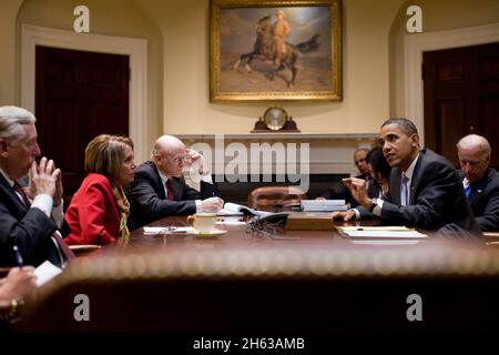 President Barack Obama meets with House Speaker Nancy Pelosi and Rep. Steny Hoyer, D-Md., for a conference call on health care in the Roosevelt Room of the White House, Jan. 5, 2010. Stock Photo