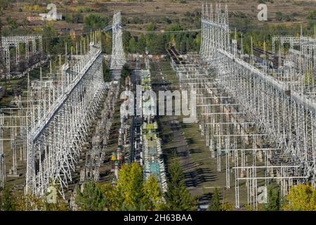 russia,siberia,bratsk,hydroelectric power station,electricity pylons and generators in the substation Stock Photo