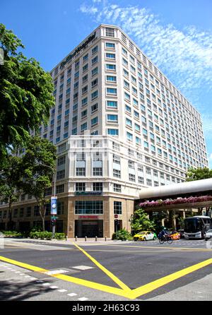 A view looking up at Raffles Hospital in theBugis area of Singapore at the intersection of Ophir Road and North Bridge Road. Stock Photo