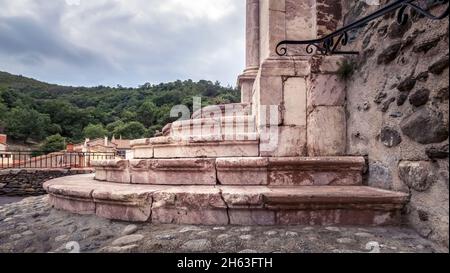 staircase made of pink marble from the region of the saint sulpice church in bouleternère. the church was built in the 17th century in the south gothic style. Stock Photo