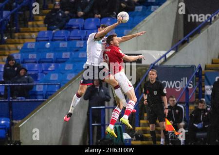 Bolton, UK. 12th Nov, 2021. Chris Porter of Crewe Alexandra in an aerial challenge during the EFL Sky Bet League 1 match between Bolton Wanderers and Crewe Alexandra at University of Bolton Stadium, Bolton, England on 12 November 2021. Photo by Mike Morese. Editorial use only, license required for commercial use. No use in betting, games or a single club/league/player publications. Credit: UK Sports Pics Ltd/Alamy Live News Credit: UK Sports Pics Ltd/Alamy Live News Stock Photo