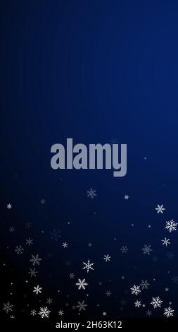 Sparse snowfall Christmas background. Subtle flying snow flakes and stars on dark blue background. Appealing winter silver snowflake overlay template. Stock Vector
