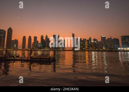 City skyline  Busines District at sunset Dubai Canal UAE Stock Photo