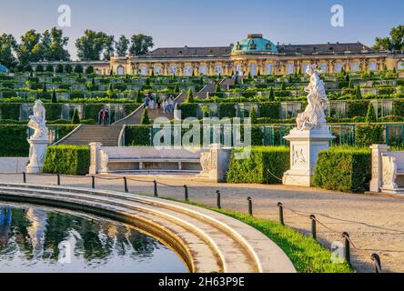 baroque sculptures in front of the vineyard terraces with sanssouci palace in the palace gardens,potsdam,brandenburg,germany Stock Photo