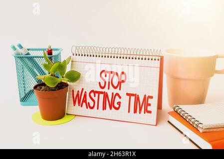 Handwriting text Stop Wasting Time. Business overview advising person or group start planning and use it wisely Tidy Workspace Setup Writing Desk Stock Photo