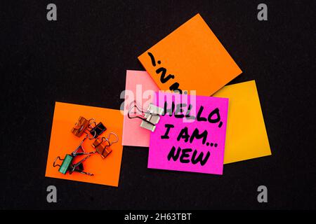 Writing displaying text Hello I Am New. Concept meaning used greeting or begin telephone conversation Multiple assorted collection office stationery Stock Photo