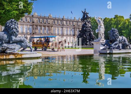 water parterre with horse-drawn carriage in front of the garden side of herrenchiemsee castle,chiemsee municipality,herreninsel,chiemgau,upper bavaria,bavaria,germany Stock Photo