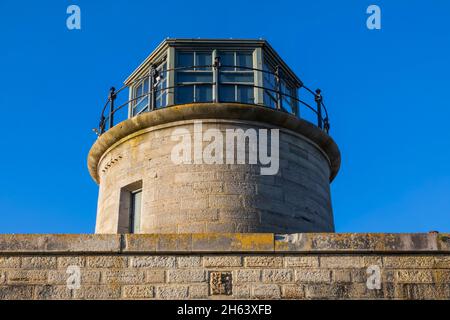 england,hampshire,the new forest,keyhaven,hurst castle,historical lighthouse tower and castle wall Stock Photo