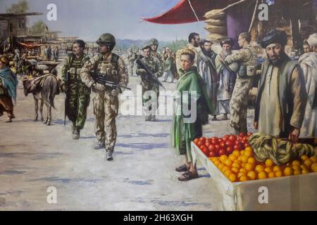 england,winchester,winchester's military quarter museums,the rifles museum,painting showing the 3rd battalion the rifles on patrol with afghan national army forces in sangin bazaar,helmand province,afghanistan in march 2010 by marcus hodge Stock Photo