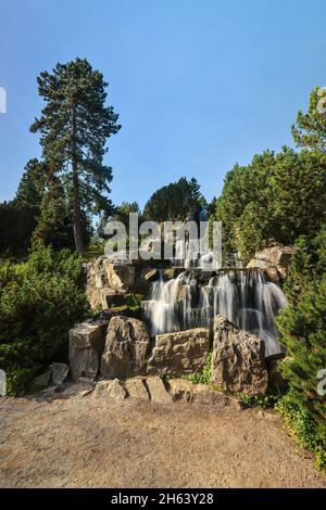 essen,north rhine-westphalia,germany - alpinum with waterfall,grugapark,a park in essen,was created from the first large ruhrland horticultural exhibition in 1929,was the park area of the federal horticultural show in 1965. Stock Photo