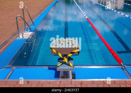 hagen,north rhine-westphalia,germany - blocked starting block at the edge of the swimming pool in the hengstey outdoor pool. Stock Photo
