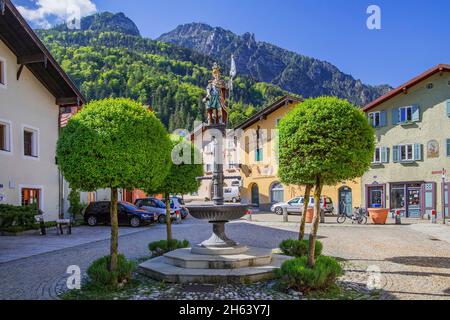 floriansplatz with fountain and typical houses in the old town against predigtstuhl 1613m in the lattengebirge,bad reichenhall,saalachtal,berchtesgaden alps,berchtesgadener land,upper bavaria,bavaria,germany Stock Photo