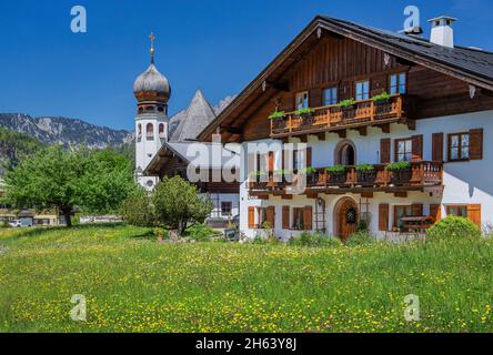 farmhouse and parish church,oberau,district of berchtesgaden,berchtesgaden alps,berchtesgadener land,upper bavaria,bavaria,germany Stock Photo