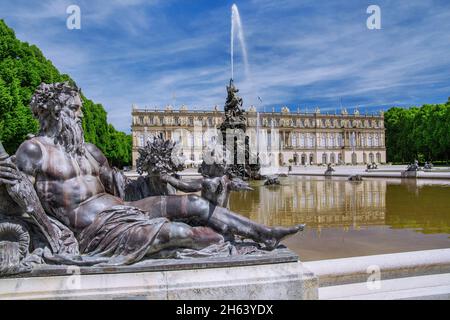 water parterre with fountain in front of the garden side of herrenchiemsee castle,municipality of chiemsee,herreninsel,chiemgau,upper bavaria,bavaria,germany Stock Photo