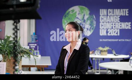 Glasgow, UK. 12th Nov, 2021. A TV reporter is seen at the 26th session of the Conference of the Parties (COP26) to the United Nations Framework Convention on Climate Change in Glasgow, United Kingdom, on Nov. 12, 2021. Alok Sharma, president of the ongoing United Nations climate change conference in Glasgow, Scotland, said Friday that he expected the negotiations for a deal will continue into Saturday afternoon. The two-week COP26 was originally scheduled to end on Friday. Credit: Han Yan/Xinhua/Alamy Live News Stock Photo