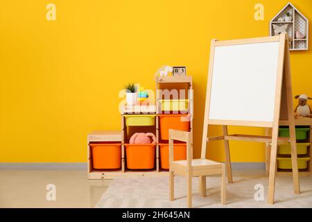 Stylish interior of modern children's room with board Stock Photo